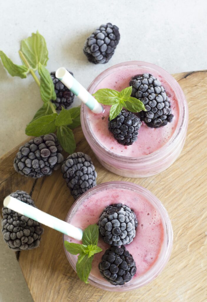 pexels-photo-434295-434295 Enjoy a refreshing blackberry smoothie topped with fresh mint leaves, perfect for a summer treat.